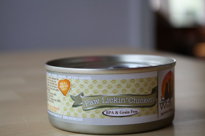A can of "Paw Lickin' Chicken" flavored cat food.