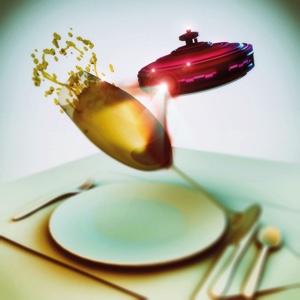 A tiny alien spaceship blasting a champagne glass with an energy cannon.